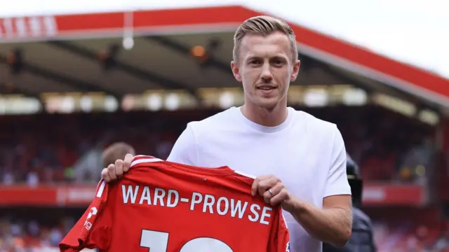 New signing James Ward-Prowse of Nottingham Forest shows off his shirt before the Premier League match between Nottingham Forest FC and Wolverhampton Wanderers FC at City Ground 