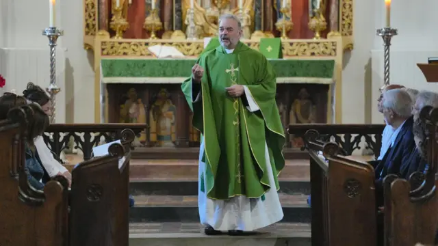 The Reverend David Stevenson, the Rector of Bushey, giving his service in Bushey