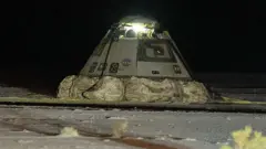 Boeing Starliner sits on desert floor at White Sands Space Harbor