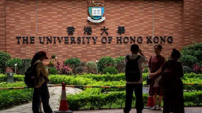 People are taking pictures with the HKU sign at the University of Hong Kong in Hong Kong, on April 30, 2024