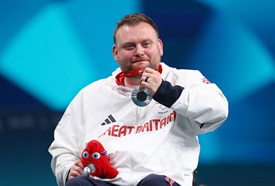 Rob Davies says he is 'chuffed to be back on the stage' after winning a silver medal at the Paris 2024 Paralympics.