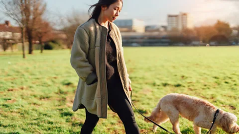 Woman walking the dog