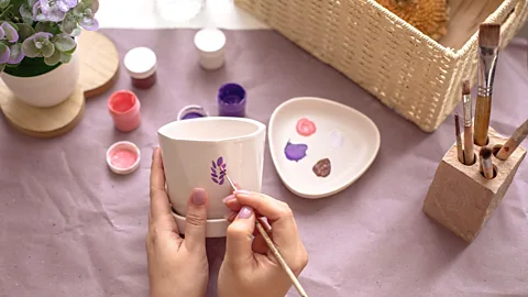 Hand painting ceramic pot (Credit: Alamy)