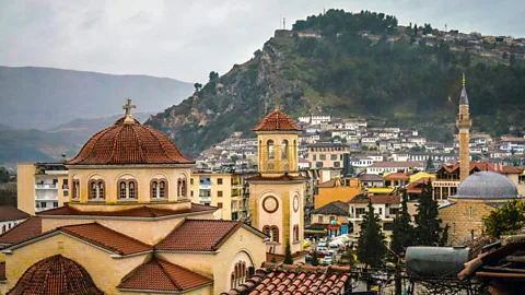 Jill Conway It is not unusual to see churches and mosques on the same streets in Albania (Credit: Jill Conway)