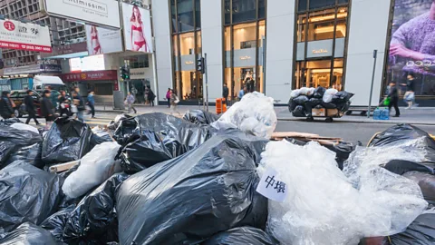 Alamy Hong Kong residents may soon have to pay a small fee for every bag of rubbish they dispose (Credit: Alamy)