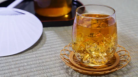 Wako Megumi/Getty Images Ice-cold glasses of mugicha (barley tea) will always remind the writer of her grandmother (Credit: Wako Megumi/Getty Images)