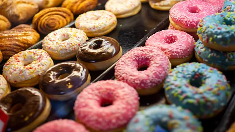 Getty Images Row of doughnuts on counter (Credit: Getty Images)