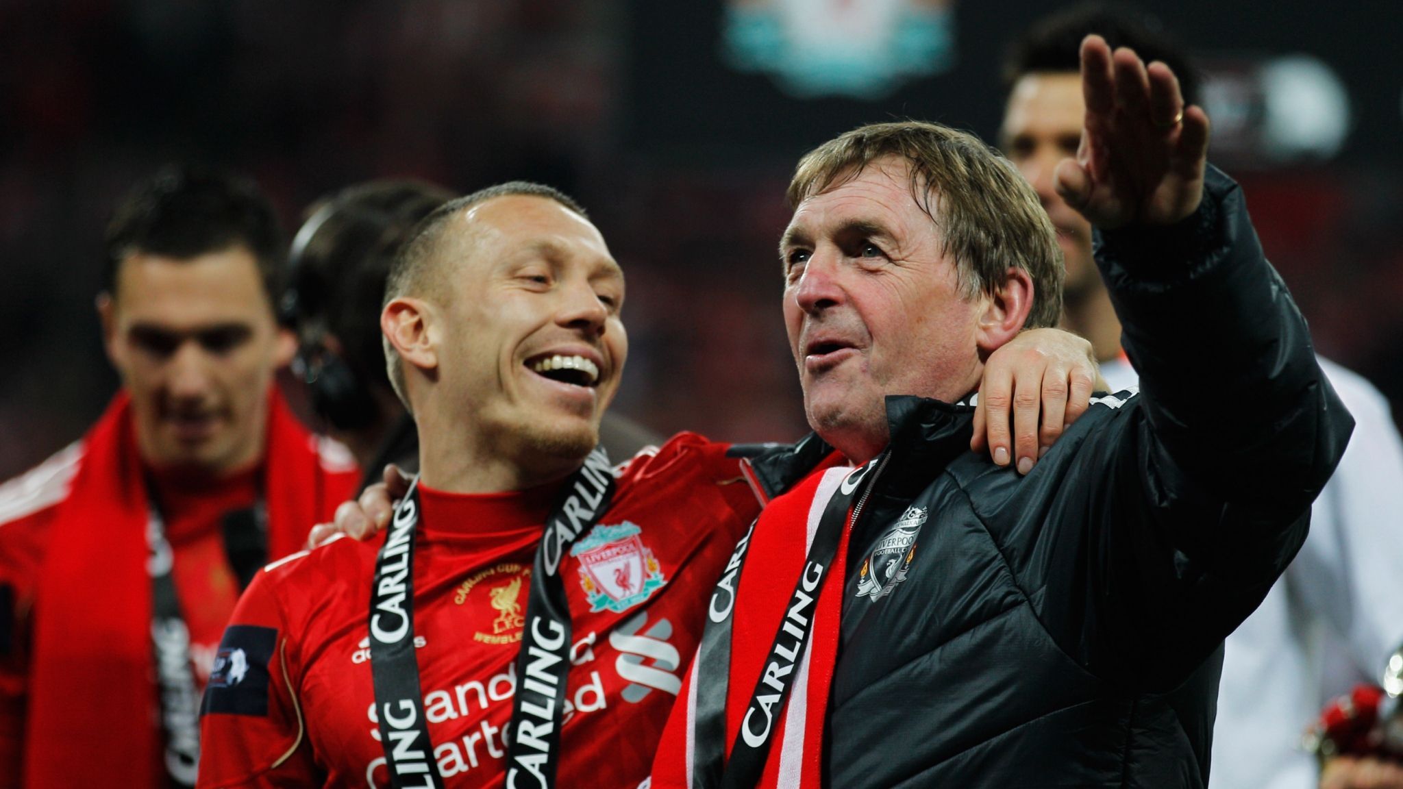 Craig Bellamy celebrates with Liverpool boss Kenny Dalglish