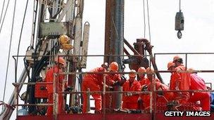 Chinese workers on an oil rig