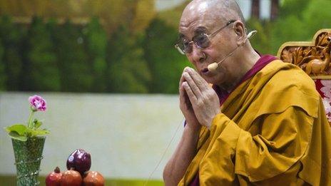 Tibetan spiritual leader the Dalai Lama prays during a talk to young Tibetans at the Tibetan Children"s Village School in Dharmsala, India, Thursday, June 27, 2013