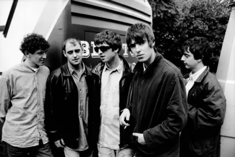 Getty Images Left to right: Tony McCarroll, Paul "Bonehead" Arthurs, Noel Gallagher, Liam Gallagher, Paul "Guigsy" McGuigan