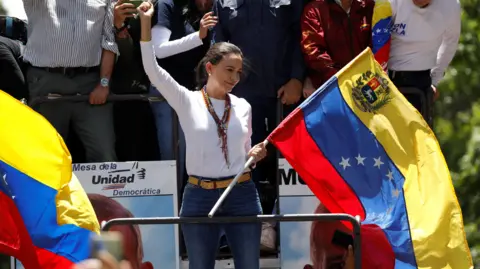 Opposition leader Maria Corina Machado addresses supporters in Caracas