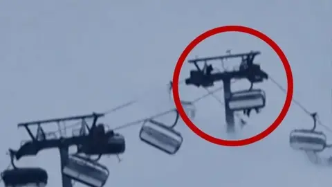 Passengers on ski lift in Italy