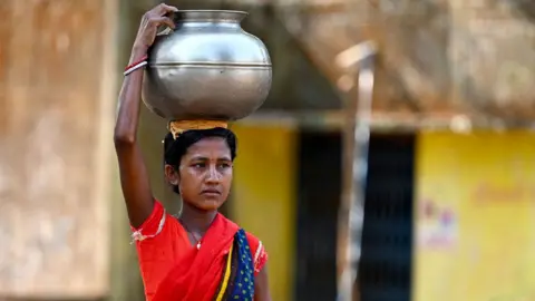 A woman carrying water in the Sukma district in Chhattisgarh, India