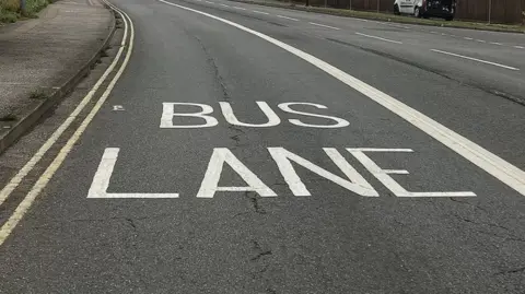 A close up picture of a bus lane