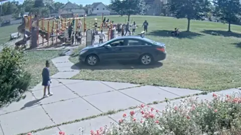 Car driving through playground