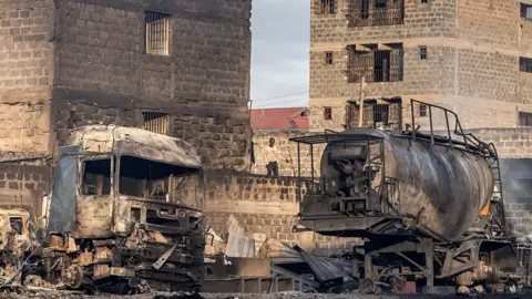 Burnt out trucks following the gas explosion