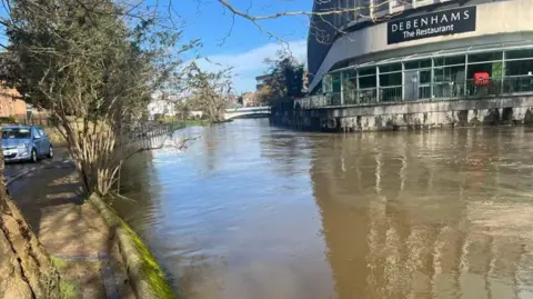 The flooding outside a shopping centre in Millmead