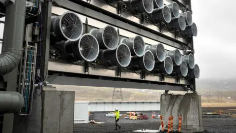 A bank of fans draws air through specialized filters at Climeworks' Mammoth carbon removal plant