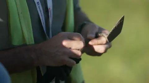 A person holding a trowel