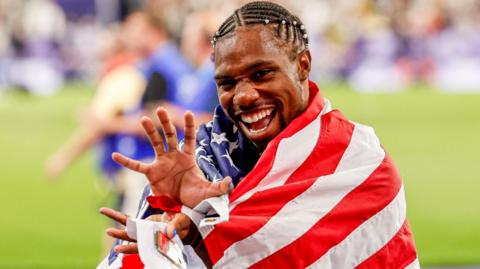 Noah Lyles celebrates