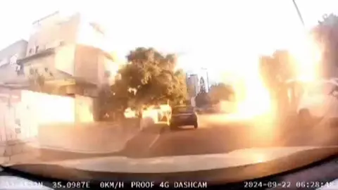 Flash of light after rocket hits a residential area in northern Israel.