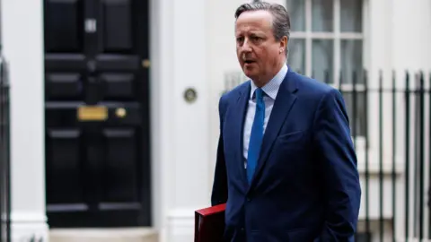 British Foreign Secretary and former prime minister, David Cameron, leaves Downing Street following a cabinet meeting of the British government in London