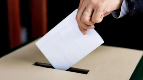 Vote ballot cast in polling box