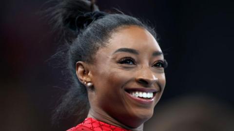 Simone Biles smiles in celebration