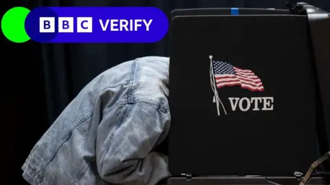 Getty Images Person filling out a ballot in a voting booth