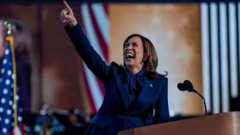 Kamala Harris smiling and pointing