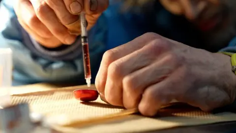 Person using drugs in a safe consumption sit