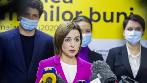 EPA Presidential candidate Maia Sandu (C) speaks to media after polling stations closed in the second round of presidential elections in Chisinau, Moldova, 15 November 2020