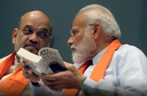 Getty Images PM Narendra Modi with Home Minister and president of BJP Amit Shah at a Parliamentary Party meeting in Parliament in Delhi on 3 August 2019