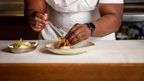 Jodi Hinds  Akoko chef Ayo Adeyemi preparing a dish