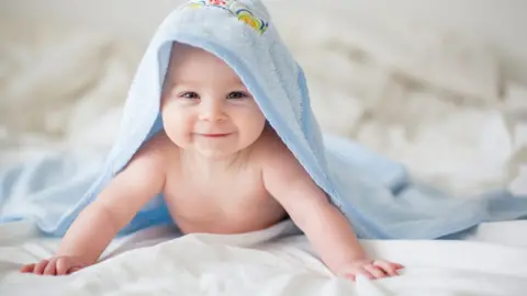 Getty Images Baby in a towel