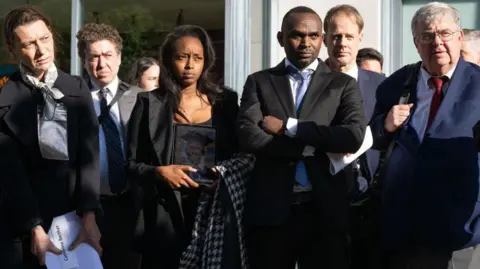 Relatives of people killed in the Ethiopian Airlines Flight 302 Boeing 737 MAX crash hold a press conference after meeting with Department of Justice officials over concerns about how the US government has handled the criminal prosecution into Boeing, outside a government office in Washington, DC, April 24, 2024.