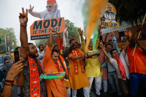 Reuters Bharatiya Janata Party (BJP) supporters celebrate outside BJP headquarters, on the day of the general election results, in New Delhi