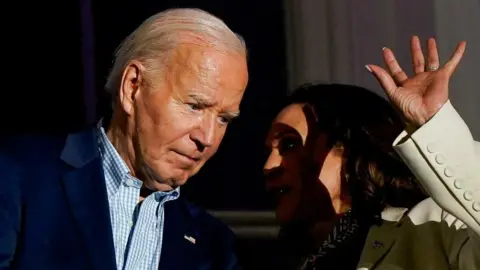 File image of Joe Biden speaking to Kamala Harris