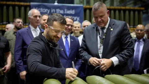 President Volodymyr Zelensky signs ammunition while visiting the Scranton Army Ammunition Plant (SCAAP) in Scranton, Pennsylvania, USA, on 23 September 2024