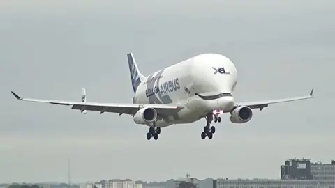 An Airbus Beluga, which shape resembles that of a beluga whale lands at Heathrow airport.