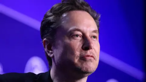 Headshot of Elon Musk with a serious expression 