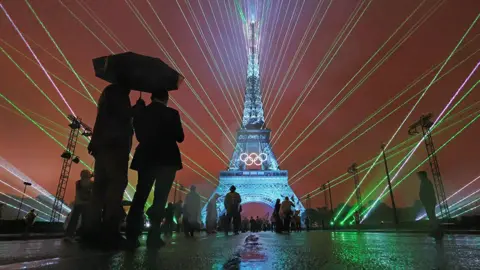 A Light Show takes place as The Olympic Rings on the Eiffel Tower are illuminated during the opening ceremony of the Olympic Games Paris 2024 at Place du Trocadero on July 26, 2024 in Paris, France.