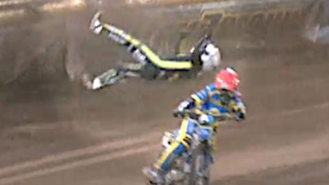 Speedway rider being thrown from his bike.