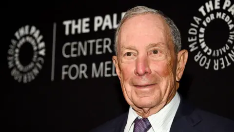 Michael Bloomberg poses for a photo 