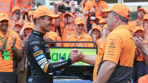 McLaren driver Lando Morris celebrates victory in the Miami F1 Grand Prix with team boss Zak Brown