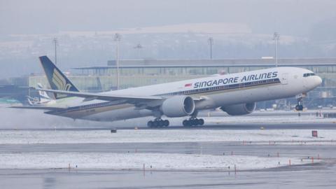 Singapore Airlines Plane seen landing on a runway