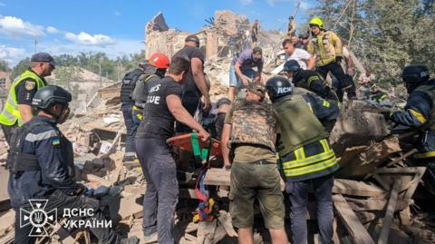 Rescuers search through the rubble after a Russian missile strike in Kryvyi Rih, southern Ukraine. Photo: 12 June 2024