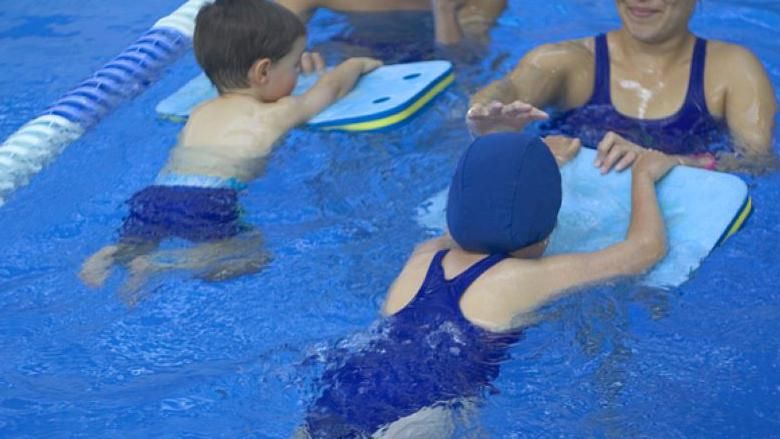 Children learning to swim.