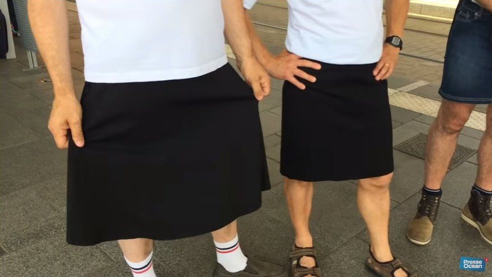 Men wearing skirts in protest